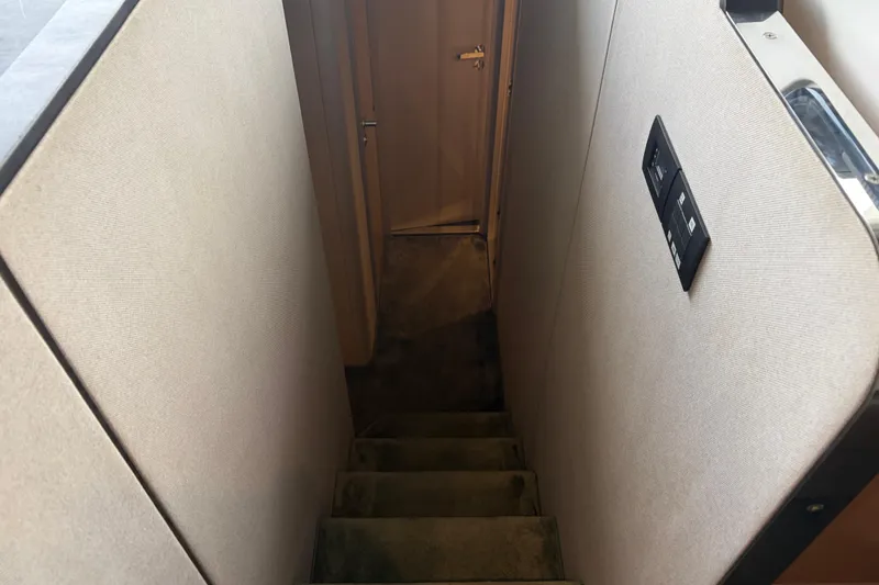 Slide: The Image of Staircase inside 2020 Azimut 55 yacht, leading to lower cabin area. - 10