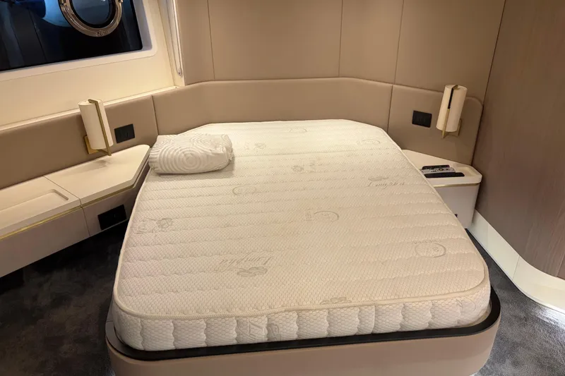 Slide: The Image of Luxurious bedroom interior of 2020 Azimut 55 yacht with plush mattress and modern design. - 16