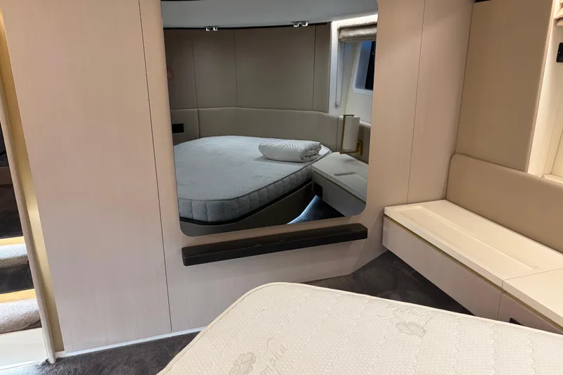 Slide: The Image of Luxurious interior of 2020 Azimut 55 yacht with elegant bedroom design. - 17
