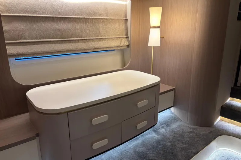 Slide: The Image of Luxurious interior of 2020 Azimut 55 yacht with modern furnishings and ambient lighting. - 18