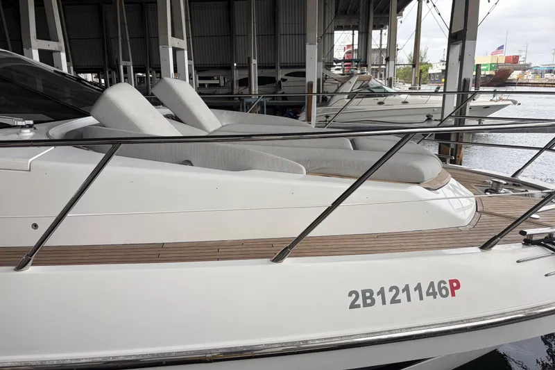 Slide: The Image of 2020 Azimut 55 yacht docked, featuring sleek design and comfortable seating. - 5