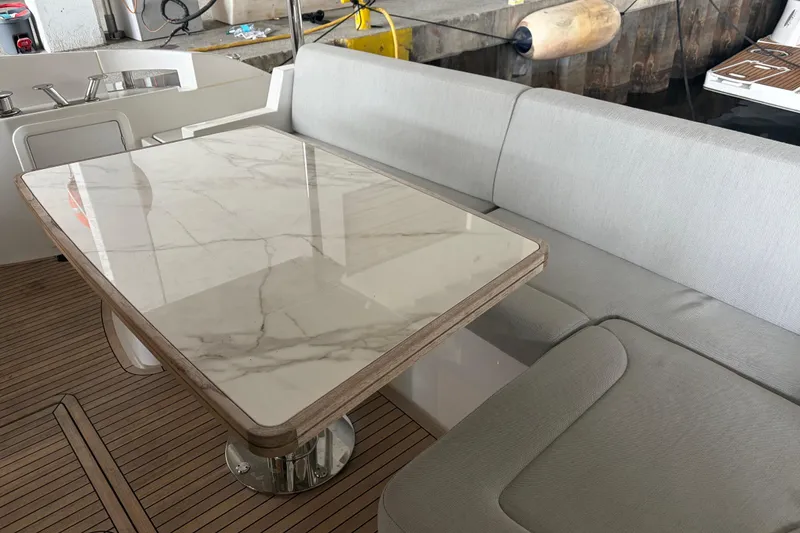 Slide: The Image of Luxurious seating area on a 2020 Azimut 55 yacht with marble table. - 7