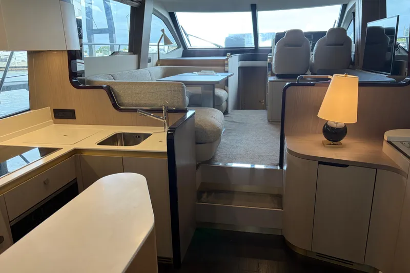 Slide: The Image of Luxurious interior of 2020 Azimut 55 yacht with modern kitchen and seating area. - 8