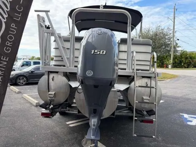 Slide: The Image of 2020 Veranda VTX22RC pontoon boat with 150 HP outboard motor, parked in a lot. - 3