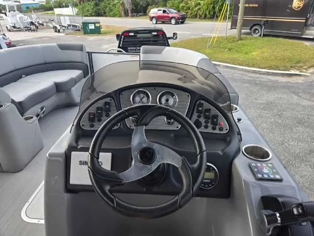 Slide: The Image of 2020 Veranda VTX22RC boat dashboard with steering wheel and control panel. - 5