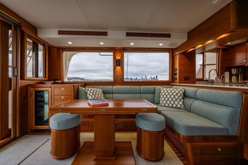 Slide: The Image of Luxurious interior of 2026 Fleming 55 Pilothouse yacht with elegant wood and blue upholstery. - 18