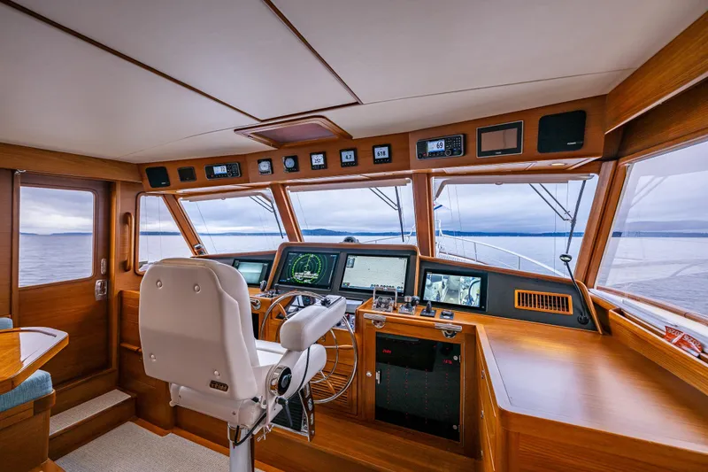 Slide: The Image of Luxurious 2026 Fleming 55 Pilothouse yacht interior with advanced navigation systems and panoramic sea views. - 28