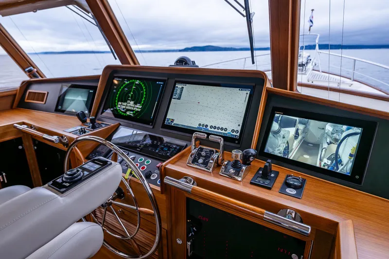 Slide: The Image of Pilothouse of 2026 Fleming 55 yacht with advanced navigation and control systems. - 32