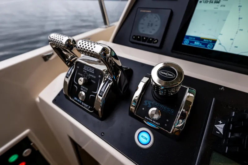 Slide: The Image of Control panel of 2026 Fleming 55 Pilothouse yacht with advanced navigation and throttle systems. - 41