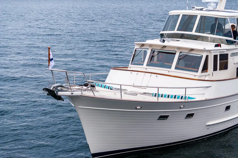 Slide: The Image of 2026 Fleming 55 Pilothouse yacht on calm ocean waters. - 1