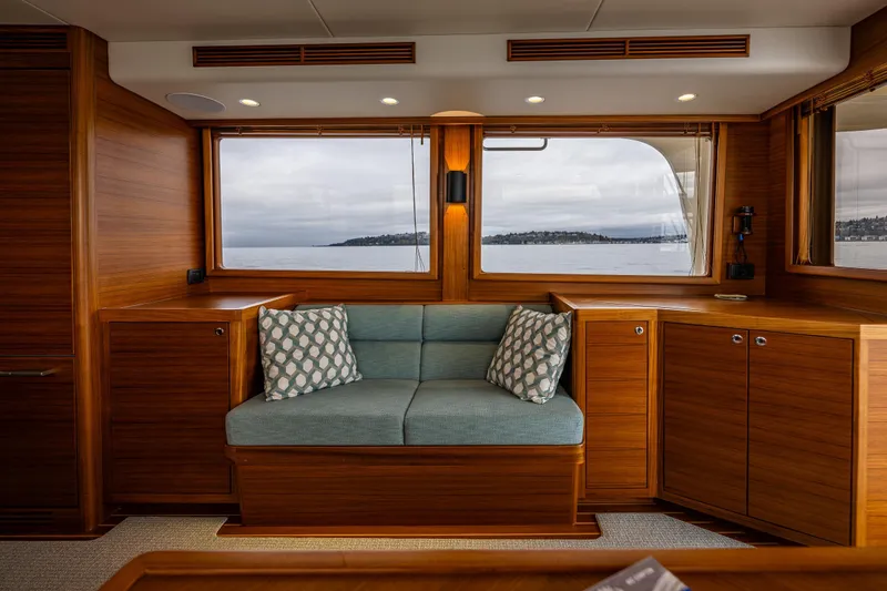 Slide: The Image of Luxurious interior of 2026 Fleming 55 Pilothouse yacht with scenic ocean view. - 21