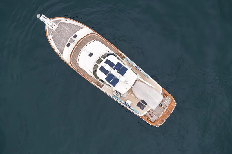 Slide: The Image of Aerial view of 2026 Fleming 55 Pilothouse yacht on calm water. - 2