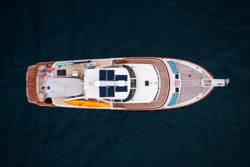 Slide: The Image of Aerial view of 2026 Fleming 55 Pilothouse yacht with solar panels and kayaks. - 3