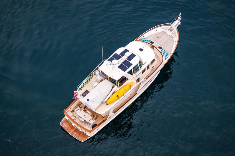 Slide: The Image of Aerial view of 2026 Fleming 55 Pilothouse yacht on calm water. - 4