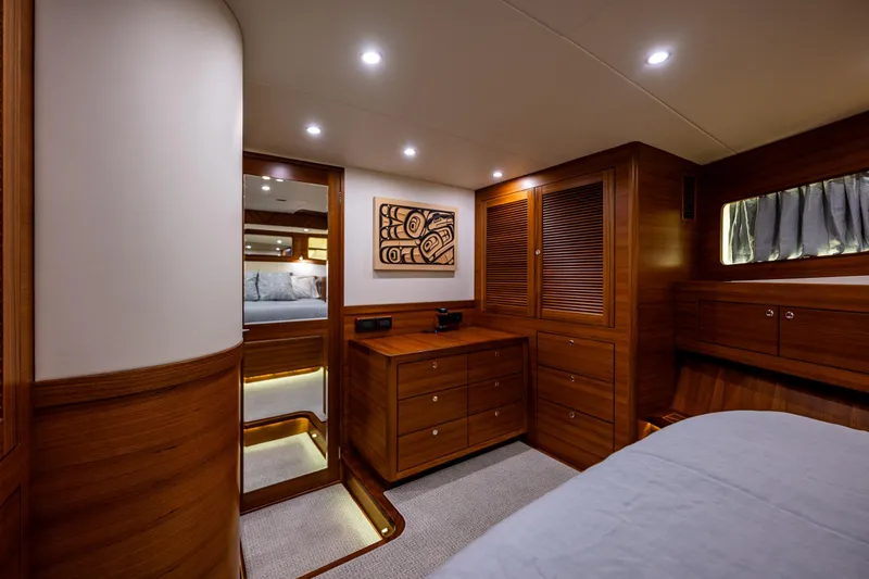 Slide: The Image of Luxurious 2026 Fleming 55 Pilothouse yacht interior with elegant wood finish and modern lighting. - 63