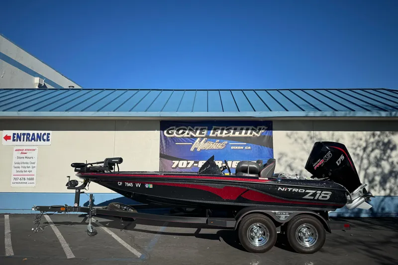 Slide: The Image of 2023 Nitro Z18 boat on trailer outside Gone Fishin' Marine store. - 1
