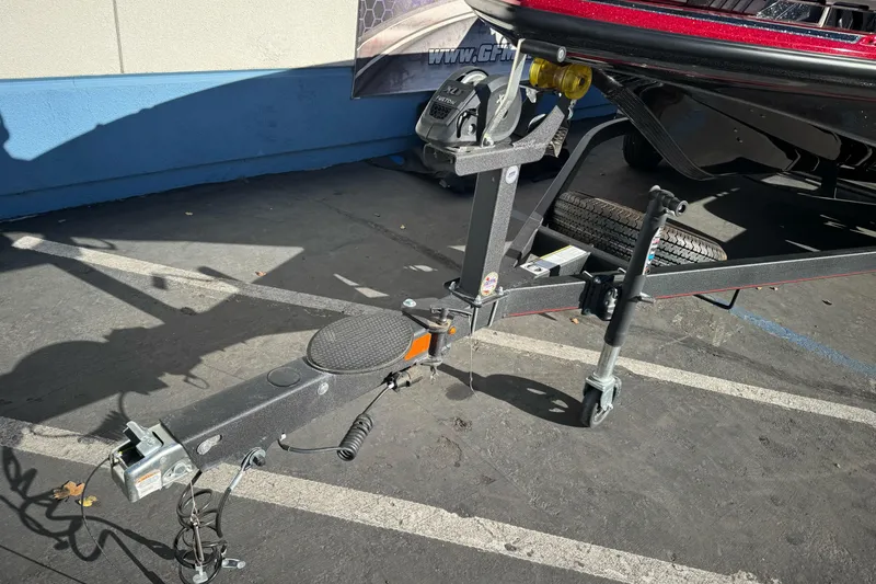 Slide: The Image of Trailer hitch of a 2023 Nitro Z18 boat, parked on asphalt. - 4