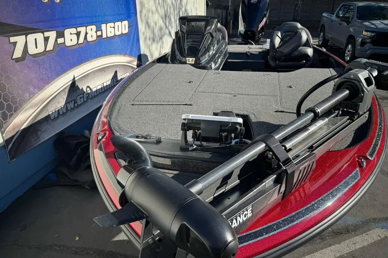 Slide: The Image of 2023 Nitro Z18 boat with trolling motor, displayed at dealership with contact information. - 5