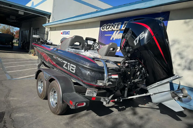 Slide: The Image of 2023 Nitro Z18 boat with 175 horsepower engine on a trailer outside a building. - 8