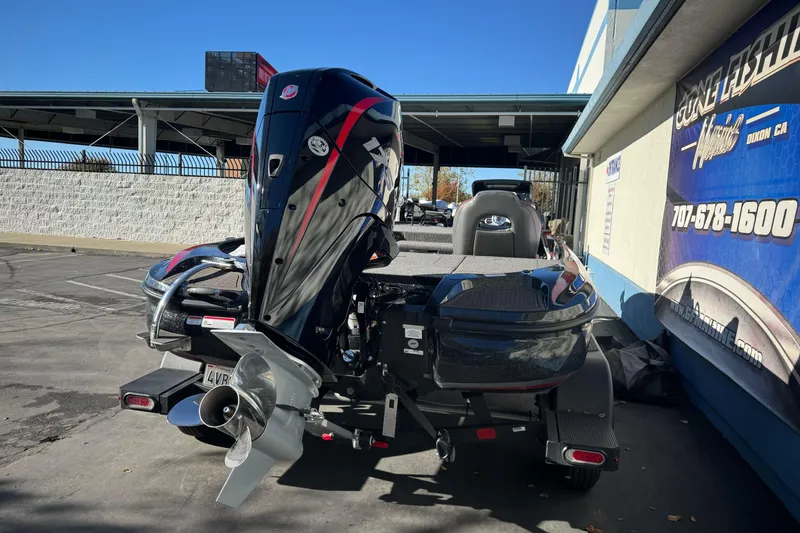 Slide: The Image of 2023 Nitro Z18 boat with powerful outboard motor in a dealership lot. - 9