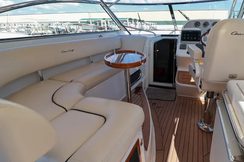 Slide: The Image of Luxurious 2004 Chris-Craft Roamer 40 yacht interior with elegant seating and wooden accents. - 12