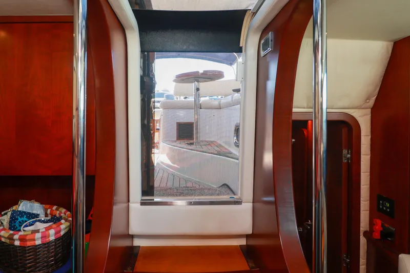 Slide: The Image of Interior view of 2004 Chris-Craft Roamer 40 yacht, featuring polished wood and modern design. - 19