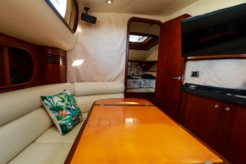 Slide: The Image of Luxurious interior of 2004 Chris-Craft Roamer 40 yacht with elegant seating and modern amenities. - 33