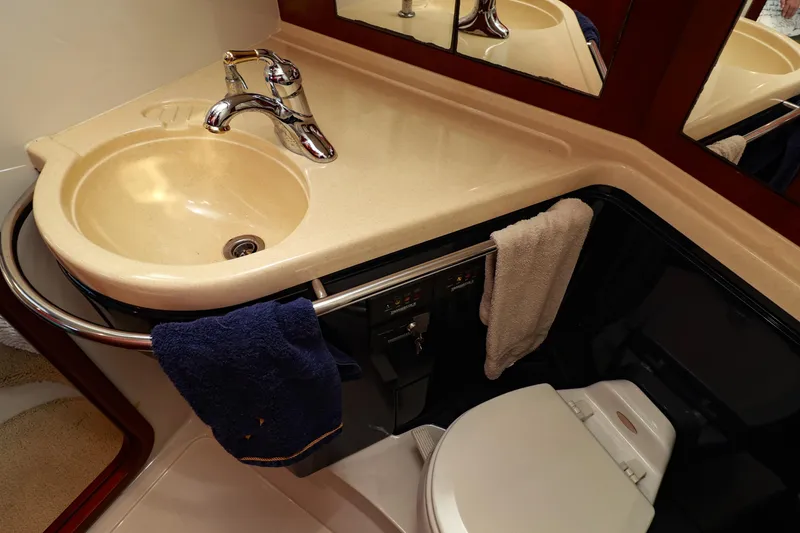 Slide: The Image of Luxurious bathroom in 2004 Chris-Craft Roamer 40 yacht with sink and toilet. - 39