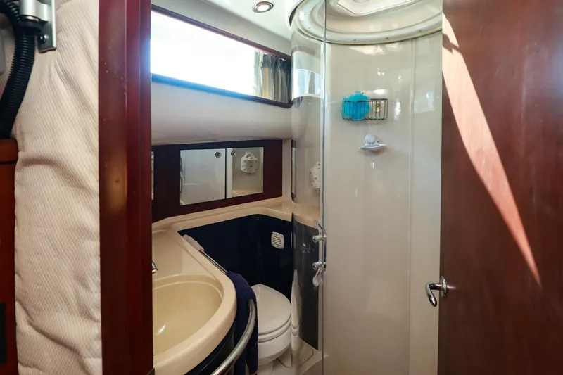 Slide: The Image of Luxurious bathroom in 2004 Chris-Craft Roamer 40 yacht with shower and vanity. - 40