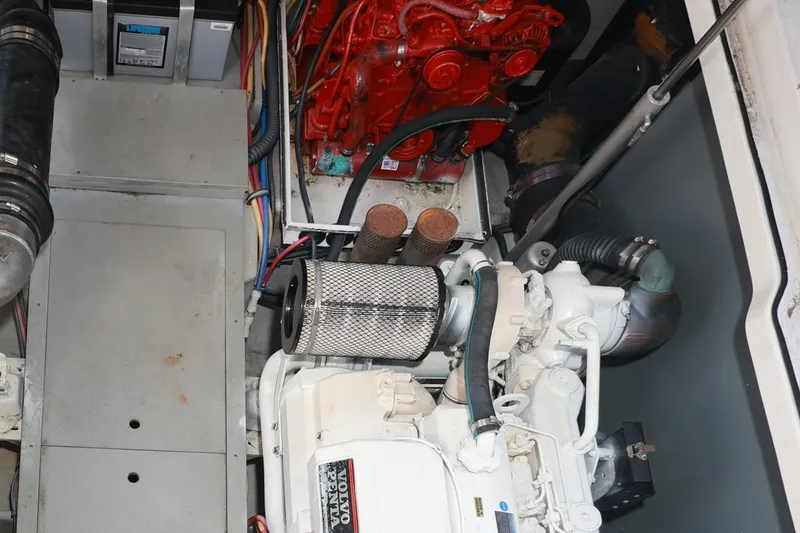Slide: The Image of Engine compartment of a 2004 Chris-Craft Roamer 40 boat, showcasing mechanical components. - 53