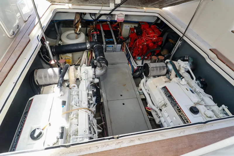 Slide: The Image of Engine room of 2004 Chris-Craft Roamer 40 with dual engines and equipment. - 54