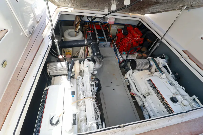 Slide: The Image of Engine room of 2004 Chris-Craft Roamer 40 yacht, showcasing dual engines and components. - 55