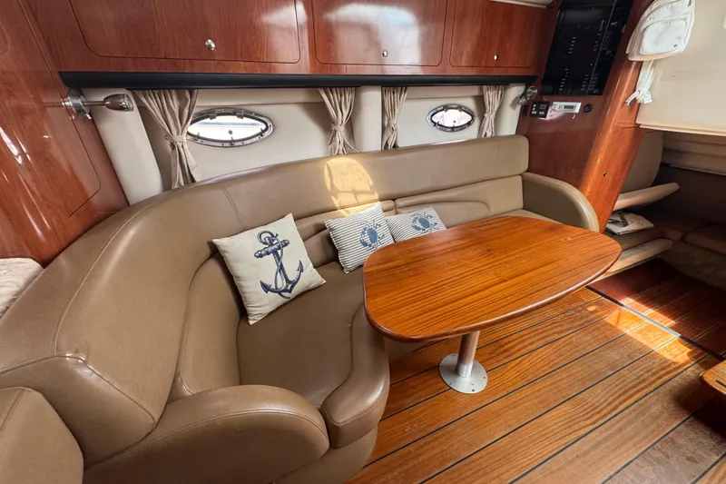 Slide: The Image of Luxurious 2008 Crownline 340 CR cabin interior with leather seating and nautical-themed cushions. - 16