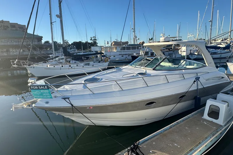 Slide: The Image of 2008 Crownline 340 CR yacht for sale, docked in marina, clear sky. - 3