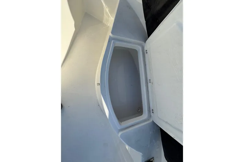 Slide: The Image of Open storage compartment on 2025 Defiance Catalina 240 boat, showcasing interior space. - 17