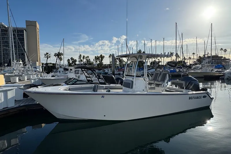 Slide: The Image of 2025 Defiance Catalina 240 boat docked in marina under sunny sky. - 3