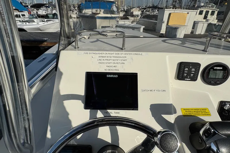 Slide: The Image of Cockpit view of 2025 Defiance Catalina 240 boat with navigation equipment and controls. - 30
