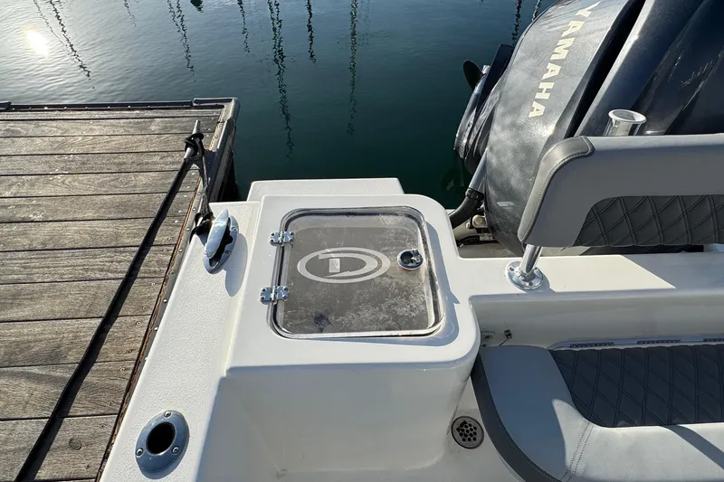 Slide: The Image of 2025 Defiance Catalina 240 boat stern with Yamaha engine at dock. - 36