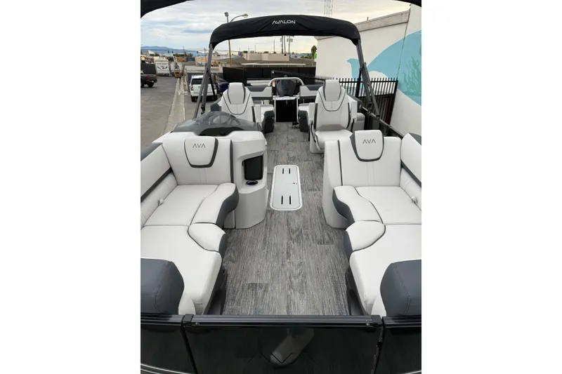 Slide: The Image of Luxurious 2026 Avalon 2385 LSZ QLS pontoon boat with spacious seating and modern design. - 2