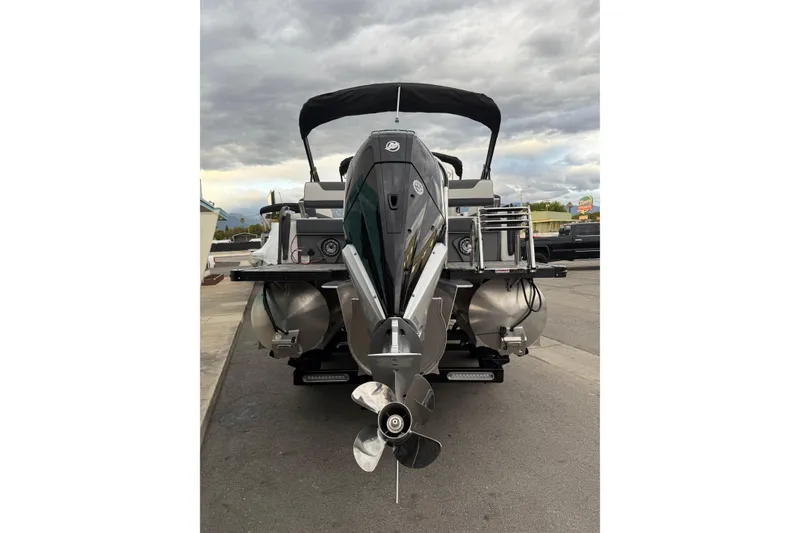 Slide: The Image of Rear view of 2026 Avalon 2385 LSZ QLS boat with outboard motor. - 6