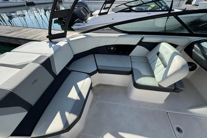 Slide: The Image of 2024 Regal 21 OBX boat interior with sleek seating and modern design. - 14