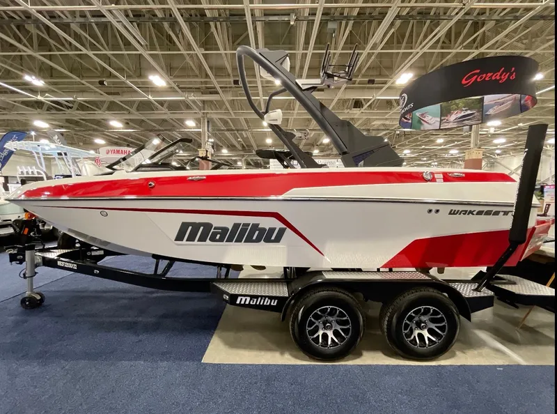 Slide: The Image of 2022 Malibu Wakesetter 20 VTX boat on display indoors. - 1