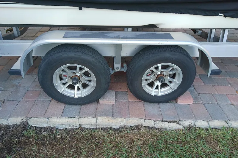 Slide: The Image of 2018 Scout 251 XSS trailer wheels on brick driveway. - 15