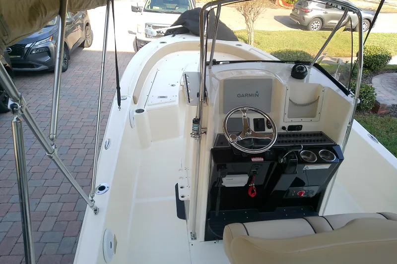 Slide: The Image of 2018 Scout 251 XSS boat interior with Garmin navigation system and steering wheel. - 24