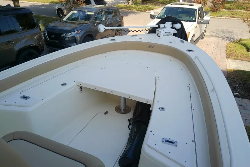 Slide: The Image of 2018 Scout 251 XSS boat interior with seating and storage compartments. - 30