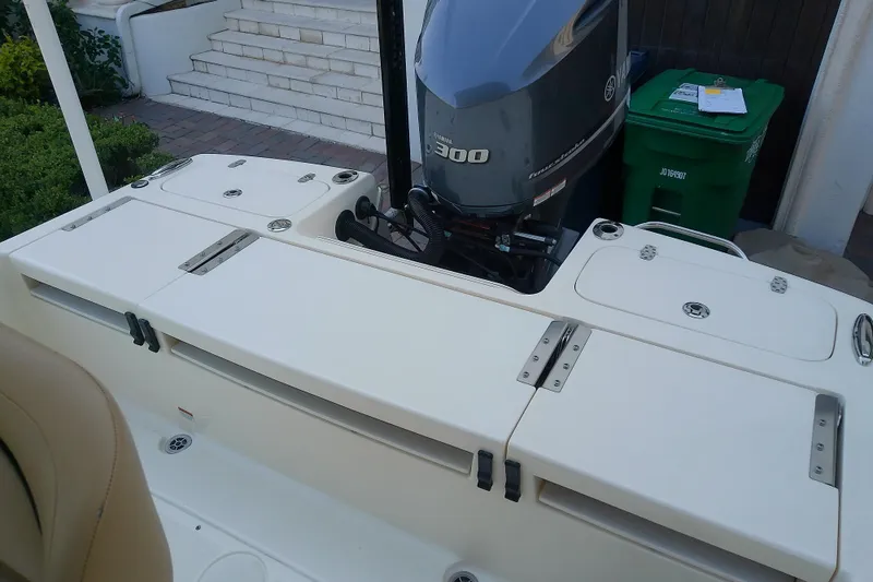 Slide: The Image of 2018 Scout 251 XSS boat with Yamaha 300 engine, docked near steps. - 40