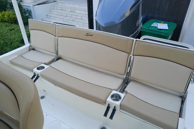 Slide: The Image of 2018 Scout 251 XSS boat seating with beige cushions and cup holders. - 41