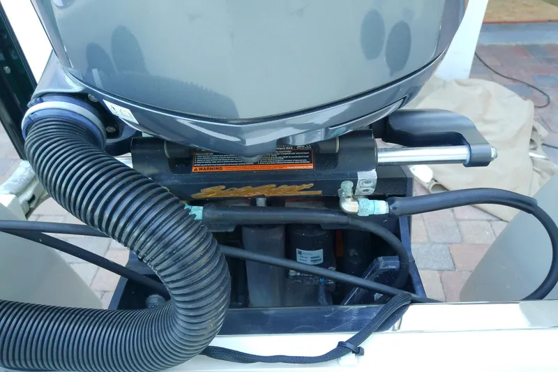 Slide: The Image of 2018 Scout 251 XSS boat engine close-up with visible hoses and components. - 44