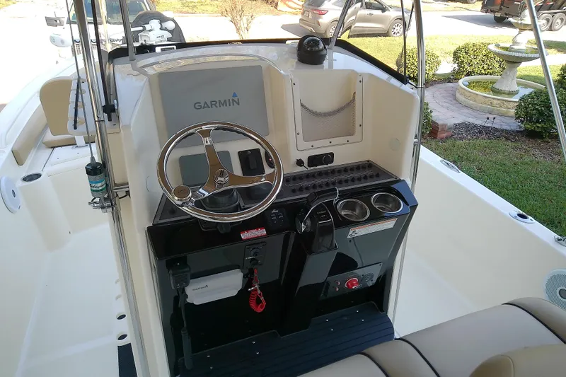 Slide: The Image of 2018 Scout 251 XSS boat dashboard with Garmin navigation system and steering wheel. - 47