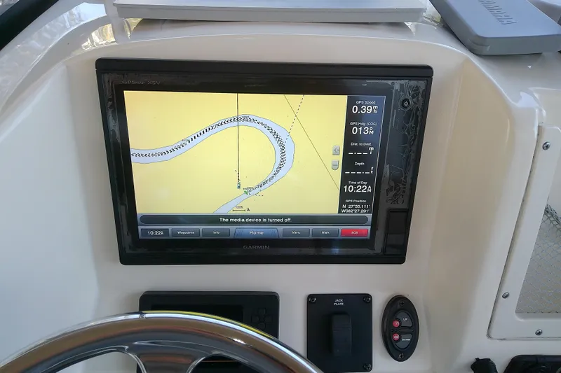 Slide: The Image of Garmin GPS display on 2018 Scout 251 XSS boat dashboard, showing navigation map. - 49
